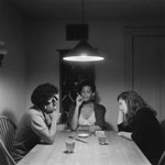 Three women sitting at a kitchen table - Weems